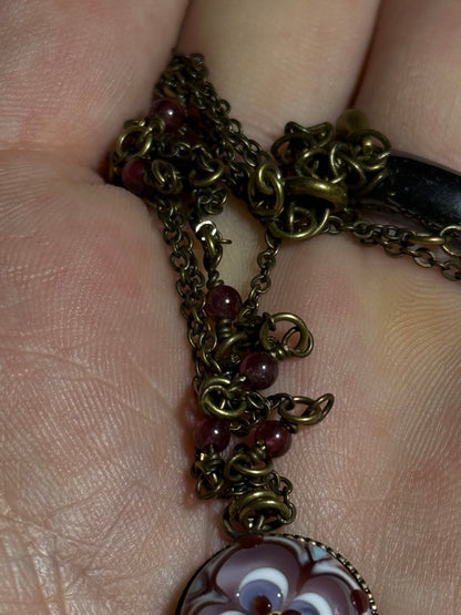 Pendant with red gemstone chain by Akiko Furuki